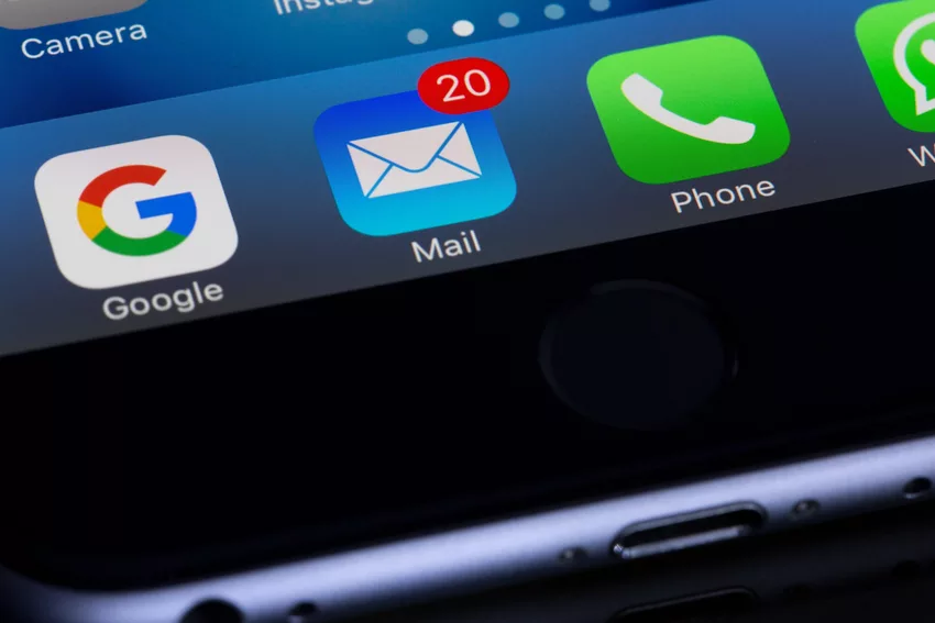 An Iphone with the widgets for google, mail, phone and contacts